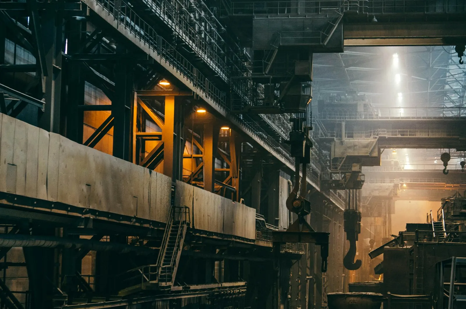 Overhead cranes and gantries in a deep heavy-industry hall